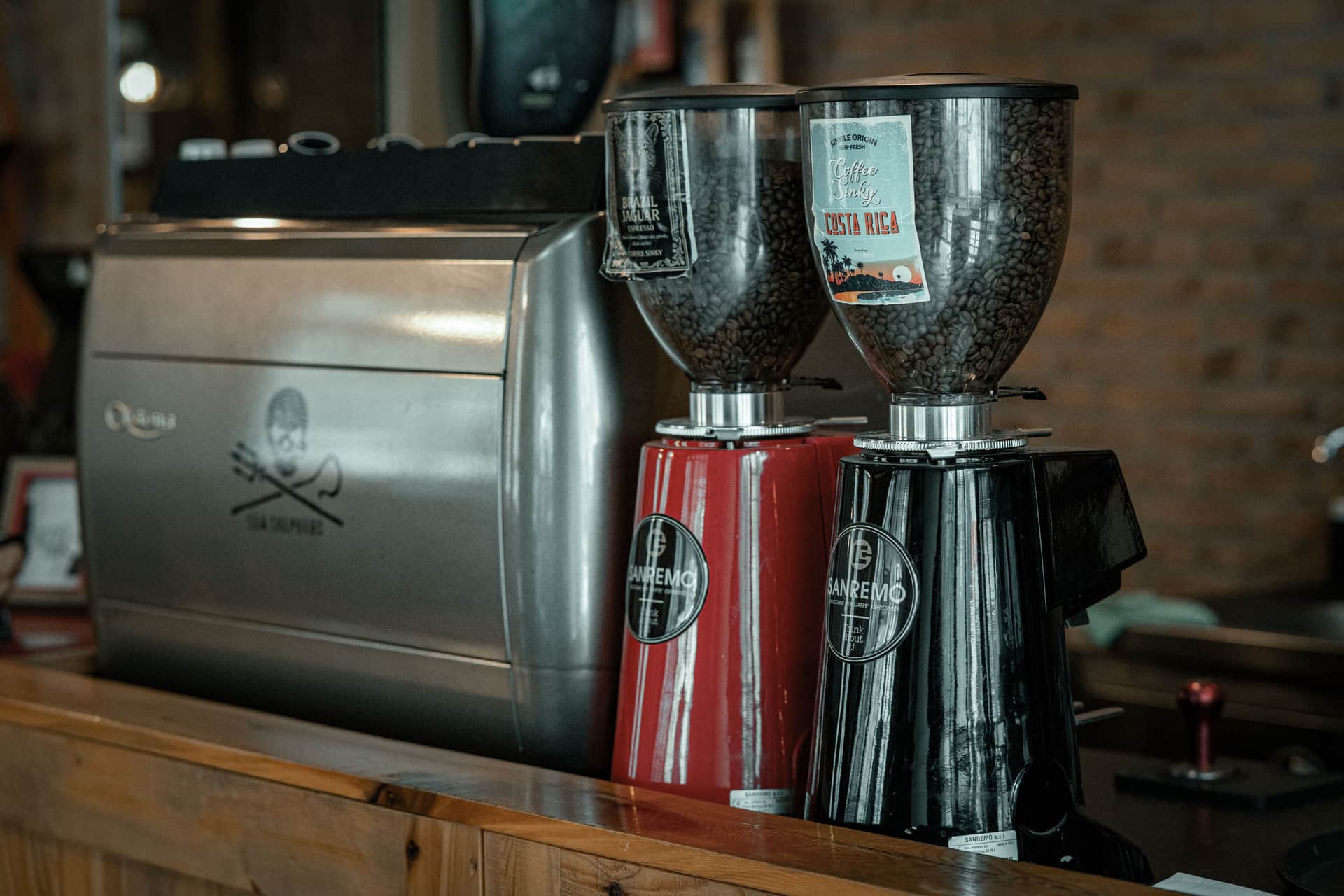 A burr coffee grinder on a dark kitchen counter